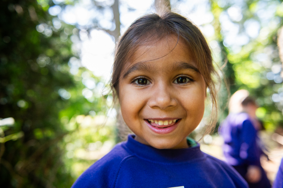 One of Maltmans Greens' girls smiling in the woodlands